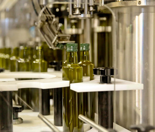 Mini-format bottles being capped